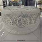 close up of white diamond islamic topi nag work